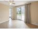 Bright bedroom featuring sliding glass doors leading to the yard at 840 E 7Th St, Englewood, FL 34223