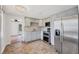 Bright kitchen featuring stainless steel appliances, stone countertops and updated cabinets at 840 E 7Th St, Englewood, FL 34223