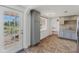 The kitchen features gray cabinets, stone tile floors, and modern lighting at 840 E 7Th St, Englewood, FL 34223