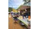 Farmer's market vendor selling raw local honey and kettle corn at 840 E 7Th St, Englewood, FL 34223