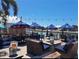 Outdoor seating area with waterfront canal view, fire pit, and string lights at 840 E 7Th St, Englewood, FL 34223