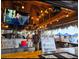 This Tiki and Grill has walk-up service, multiple televisions, and thatched roof at 840 E 7Th St, Englewood, FL 34223