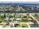 Neighborhood aerial showcasing the home's location amidst mature trees and well-maintained streets at 849 Palmetto St, Englewood, FL 34223