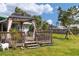 Relaxing backyard featuring a gazebo with a sitting area, and a well-manicured lawn at 849 Palmetto St, Englewood, FL 34223