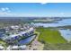 Aerial view of community waterfront condos, a golf course, and scenic waterways at 9203 Griggs Rd # 204, Englewood, FL 34224