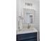 Bathroom vanity with modern lights, and a mirror above the sink at 9203 Griggs Rd # 204, Englewood, FL 34224
