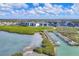 Aerial view of boat docks on the water, with boats docked, adjacent to residential buildings at 9203 Griggs Rd # 204, Englewood, FL 34224