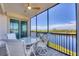 Relax on the screened patio with scenic river views and comfortable outdoor seating at 9203 Griggs Rd # 204, Englewood, FL 34224