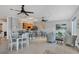 Spacious recreation room with a wet bar, seating areas, and stylish decor for entertaining guests at 9203 Griggs Rd # 204, Englewood, FL 34224