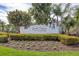 Elegant community signage for Grande Preserve on Lemon Bay surrounded by landscaping at 9203 Griggs Rd # 204, Englewood, FL 34224