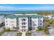 This is a great aerial view of the condo with a view of the ocean in the background at 9203 Griggs Rd # A204, Englewood, FL 34224