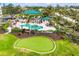 Aerial view showcasing the pool and putting green at 9203 Griggs Rd # A204, Englewood, FL 34224