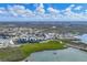 Aerial view of community condominiums with boat docks and waterway access in a coastal town at 9203 Griggs Rd # A204, Englewood, FL 34224