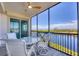 Relaxing balcony with scenic waterfront views at 9203 Griggs Rd # A204, Englewood, FL 34224