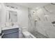 Contemporary bathroom with walk-in shower featuring marble tile and modern fixtures at 9203 Griggs Rd # A204, Englewood, FL 34224