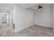Modern bedroom with wood-look floors, white wainscoting, and stylish ceiling fan at 9203 Griggs Rd # A204, Englewood, FL 34224