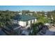 Modern community center boasting a beautiful green metal roof and outdoor seating areas at 9203 Griggs Rd # A204, Englewood, FL 34224