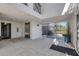 Spacious building lobby with elevator and tiled floors at 9203 Griggs Rd # A204, Englewood, FL 34224