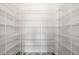 Bright walk-in pantry features adjustable wire shelving and ample storage space at 9203 Griggs Rd # A204, Englewood, FL 34224