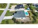 Aerial view of the home showing the pool and backyard with neighboring properties at 9265 Carnation Ave, Englewood, FL 34224