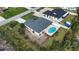 Aerial view of the property showcasing the pool and yard at 9265 Carnation Ave, Englewood, FL 34224