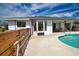 Backyard pool with patio, surrounded by a well-maintained yard, perfect for outdoor enjoyment at 9265 Carnation Ave, Englewood, FL 34224