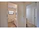 Bright bathroom featuring tile flooring and a single vanity with white cabinets at 9265 Carnation Ave, Englewood, FL 34224