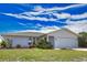 Beautiful single Gathering home with manicured lawn and two car garage at 9265 Carnation Ave, Englewood, FL 34224