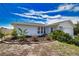 Beautiful single Gathering home with manicured lawn and two car garage at 9265 Carnation Ave, Englewood, FL 34224