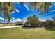 Beautiful single Gathering home with manicured lawn, landscaping and two car garage at 9265 Carnation Ave, Englewood, FL 34224
