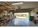 A view from the spacious garage looking out to the front yard and the street at 9265 Carnation Ave, Englewood, FL 34224