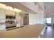 Well-lit kitchen featuring stainless steel appliances and ample counter space at 9265 Carnation Ave, Englewood, FL 34224