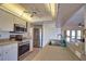 Bright kitchen with stainless steel appliances and pantry at 9265 Carnation Ave, Englewood, FL 34224