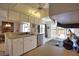 Kitchen with a breakfast bar overlooking the dining area at 9265 Carnation Ave, Englewood, FL 34224