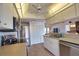 Kitchen featuring stainless steel appliances, ample storage, and tile flooring at 9265 Carnation Ave, Englewood, FL 34224