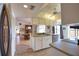 Open-concept kitchen with a breakfast bar and views of the dining area at 9265 Carnation Ave, Englewood, FL 34224