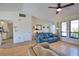 Inviting living room featuring vaulted ceilings, neutral walls, and plentiful seating at 9265 Carnation Ave, Englewood, FL 34224