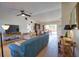 Inviting living room with ceiling fan, TV, and dining room visible at 9265 Carnation Ave, Englewood, FL 34224