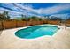 Backyard pool with deck, surrounded by tropical plants and trees at 9265 Carnation Ave, Englewood, FL 34224