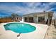 Sparkling pool with clear blue water, surrounded by a patio and lush landscaping for a serene escape at 9265 Carnation Ave, Englewood, FL 34224