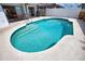 Inviting backyard pool surrounded by a spacious patio, perfect for outdoor entertaining and relaxation at 9265 Carnation Ave, Englewood, FL 34224