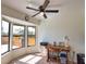 Sun room with tiled floor and large windows at 9265 Carnation Ave, Englewood, FL 34224