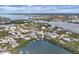 Beautiful aerial shot of waterfront homes featuring docks, Gulf views, and boat access at 97 Kettle Harbor Dr, Placida, FL 33946