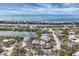 Aerial view of waterfront community with beautiful blue Gulf views and lush landscaping at 97 Kettle Harbor Dr, Placida, FL 33946