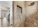 Walk-in shower with gray tile and a built-in niche for toiletries at 97 Kettle Harbor Dr, Placida, FL 33946