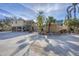 Elevated two-story beach home with lush landscaping and a boat port at 97 Kettle Harbor Dr, Placida, FL 33946