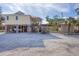 Coastal home on stilts with ample parking space for vehicles and boats and stairs to the beach at 97 Kettle Harbor Dr, Placida, FL 33946