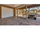 Covered parking area with a brick-paver surface, stairs, and a golf cart at 97 Kettle Harbor Dr, Placida, FL 33946