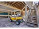 Covered parking area with a boat, a golf cart, and stairs leading to the home at 97 Kettle Harbor Dr, Placida, FL 33946