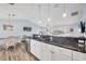 Open floor plan featuring granite counters, stainless steel appliances, and dining area at 97 Kettle Harbor Dr, Placida, FL 33946